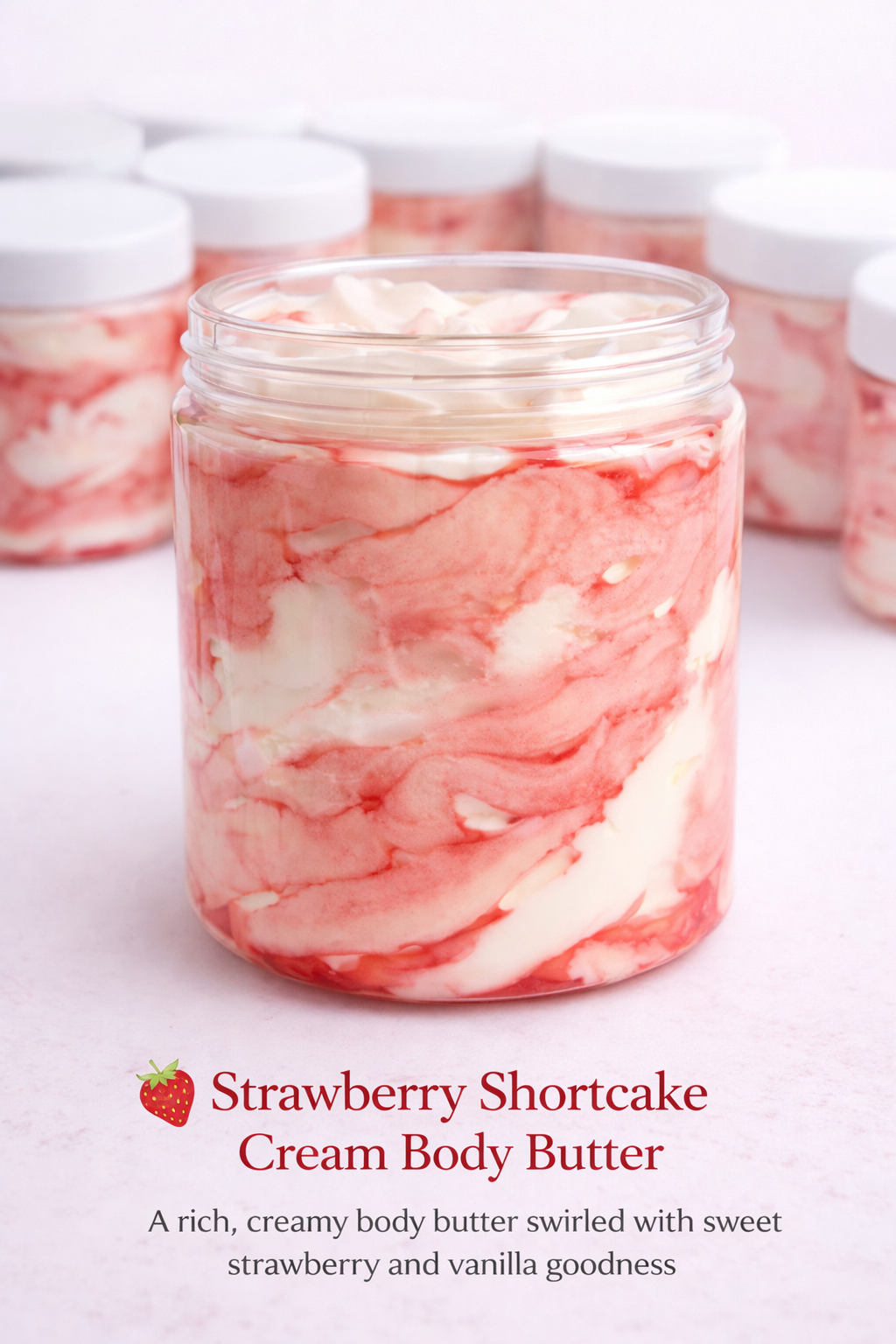 Jar of strawberry shortcake cream body butter with marbled design on a white background